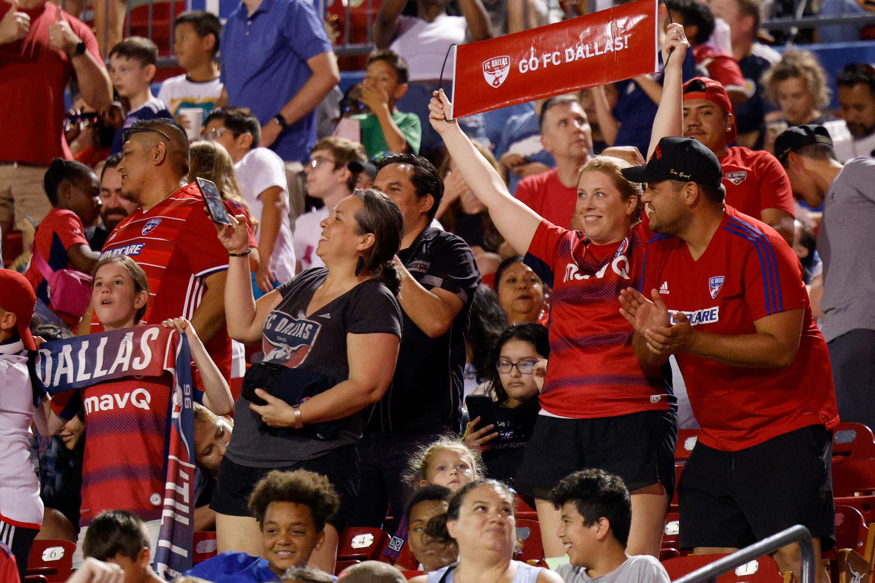 FC Dallas fans celebrate a goal by forward Petar Musa during the second half of an MLS...