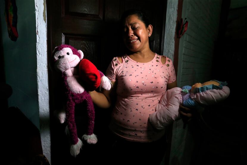 Rosa Ramirez sobs as she shows journalists toys that belonged to her nearly 2-year-old...