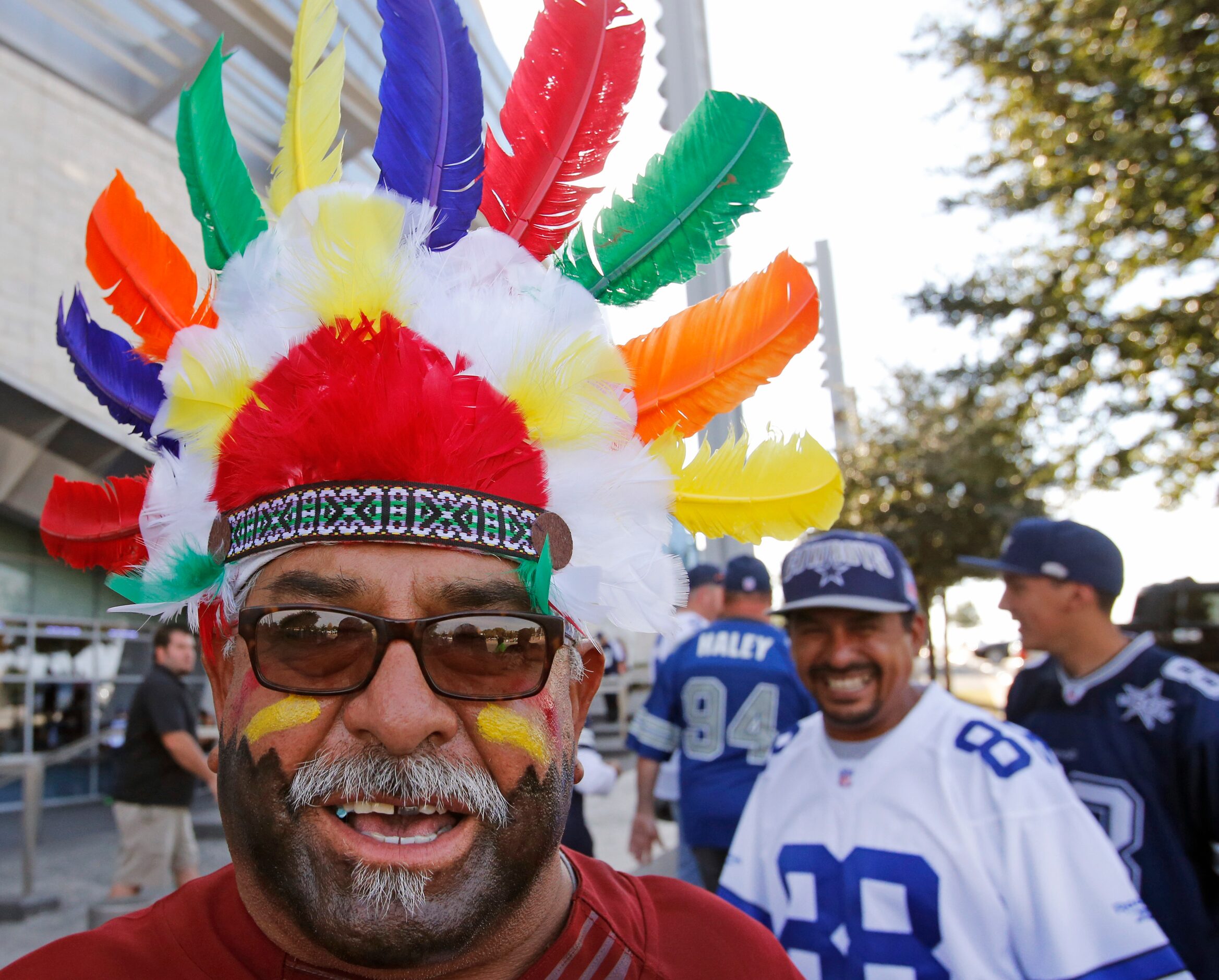 "Pistol" Pete Renteria from Boise, Idaho wears a headdress as he arrives at the stadium to...