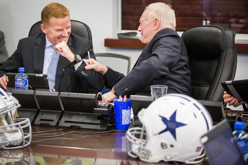 Dallas Cowboys head coach Jason Garrett (left) laughs with owner Jerry Jones in the team's...