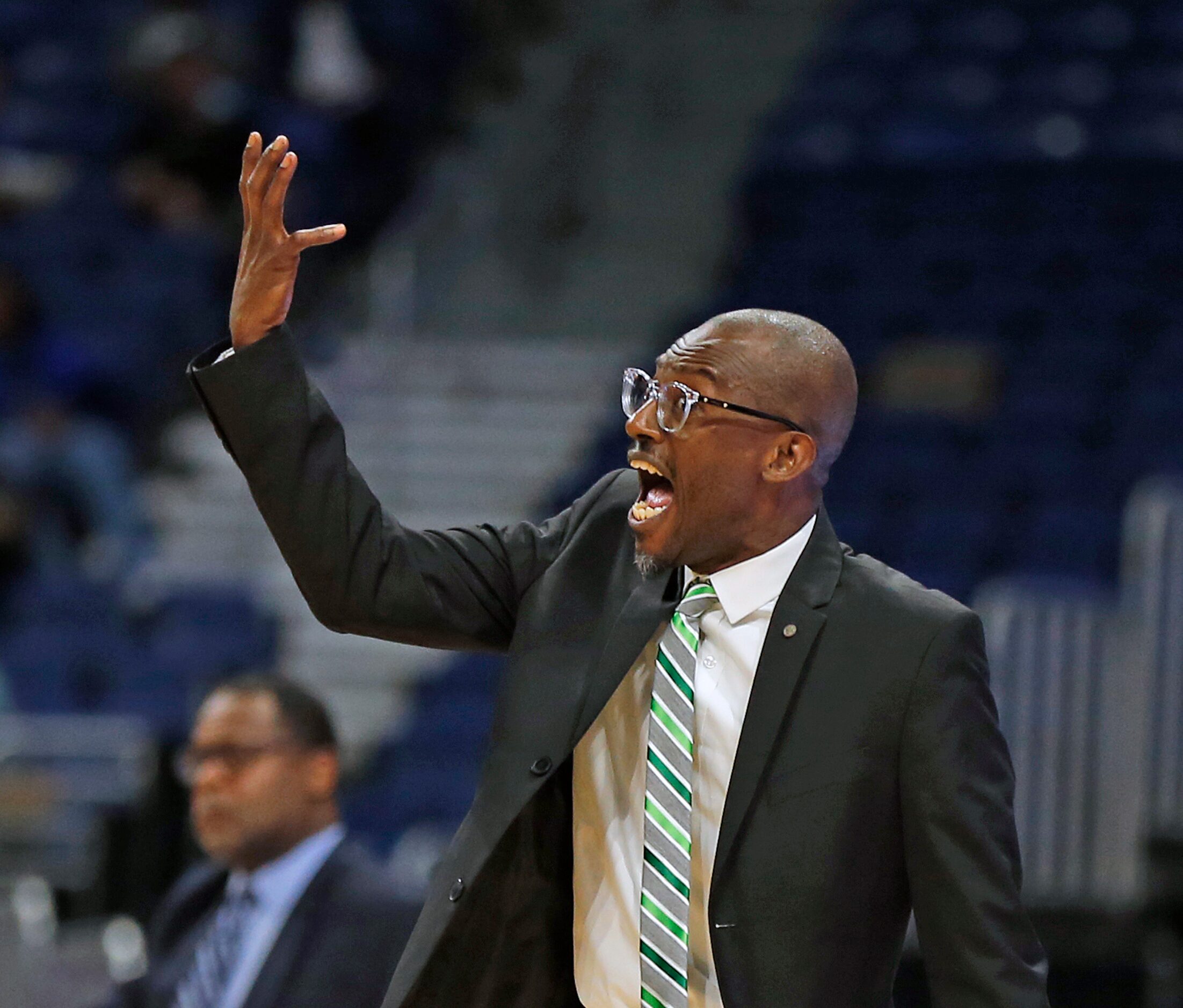 Madison head coach Damien Mobley yells instruction to his team. Madison defeated...