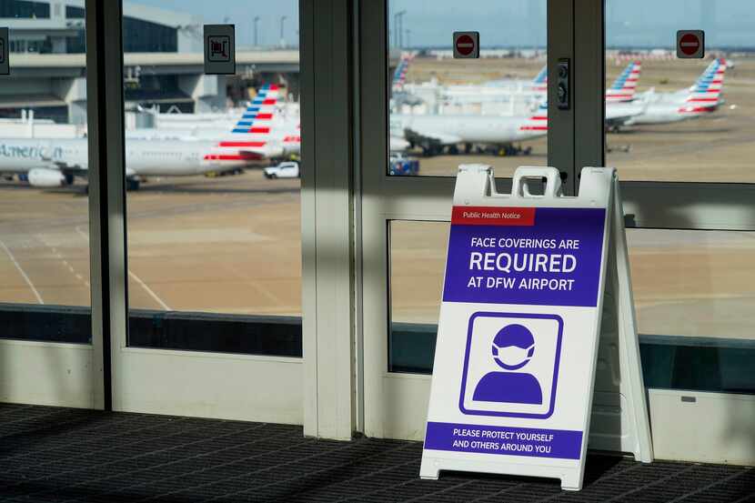 Signs at a Skylink train station notified travelers of face mask requirements as American...