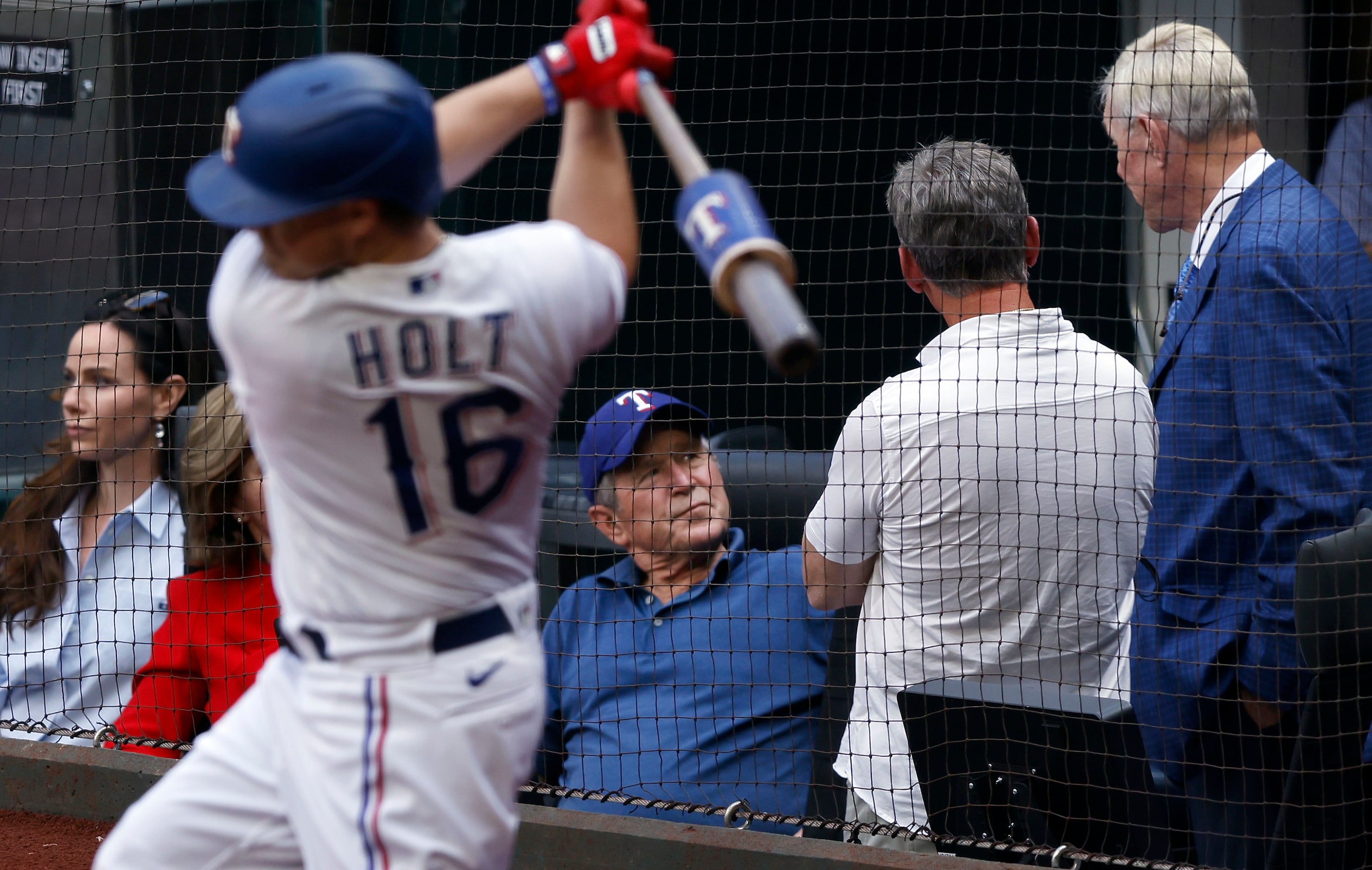 Former President George W. Bush (center) visits with former Houston Astros player Craig...