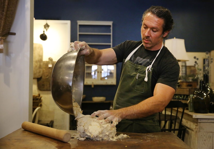 Chef Robert Lyford prepares cheddar biscuits at Patina Green Home and Market in McKinney.