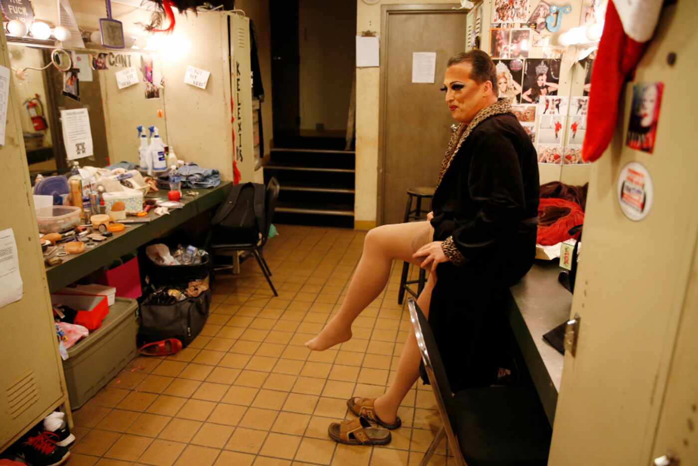 James Love puts on his pantyhose before performing as "Cassie Nova" at Sue Ellen's in...