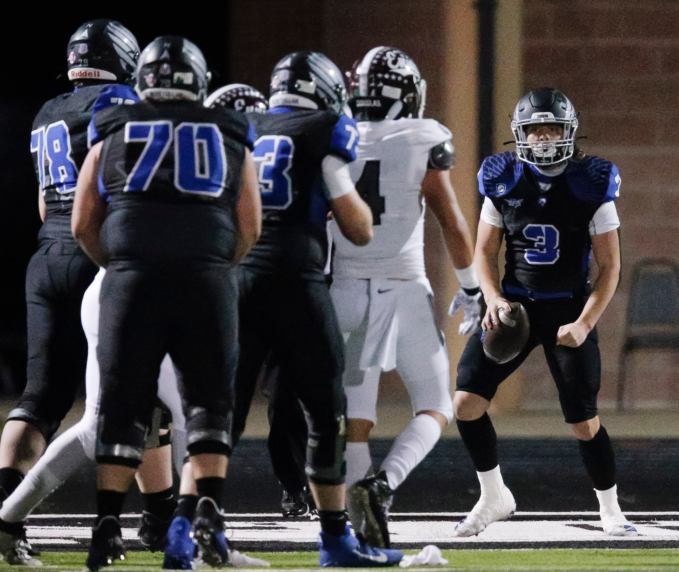 North Forney senior quarterback Jacob Acuna (3) celebrates scoring a touchdown during the...