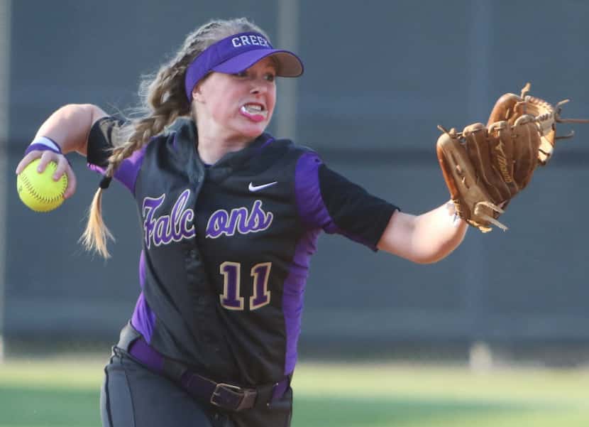 Timber Creek's Avery Grimes throws a ground ball to first during the 1st inning of the Class...