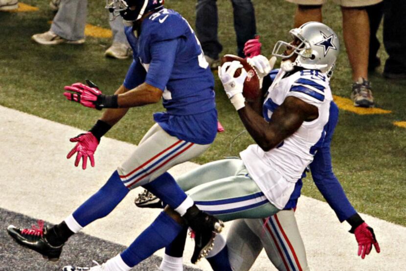 Dallas Cowboys wide receiver Dez Bryant (88) pulls in a pass past New York Giants cornerback...