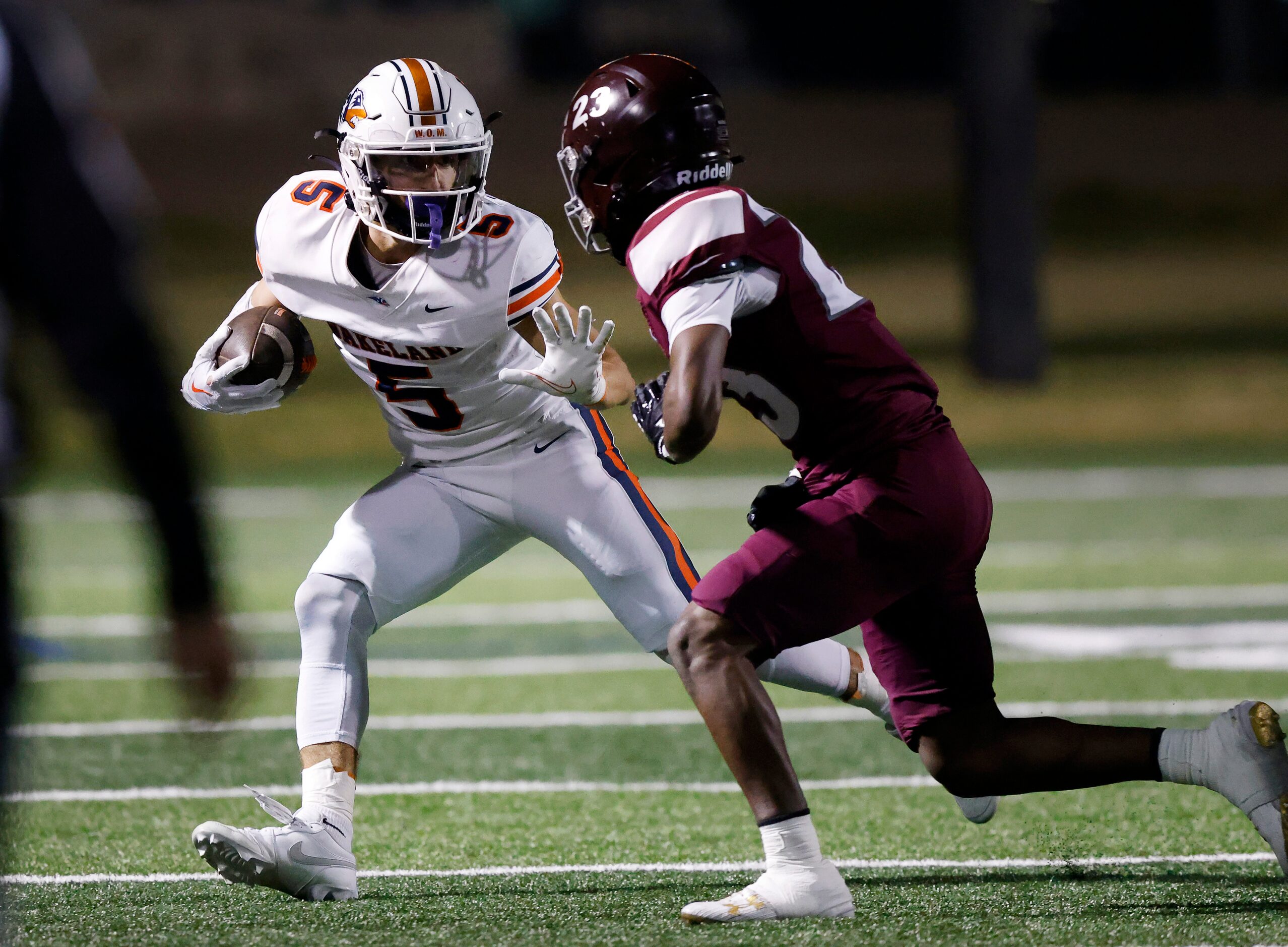 Frisco Wakeland wide receiver Ashdyn Kahouch (5) tries to elude Mansfield Timberview...