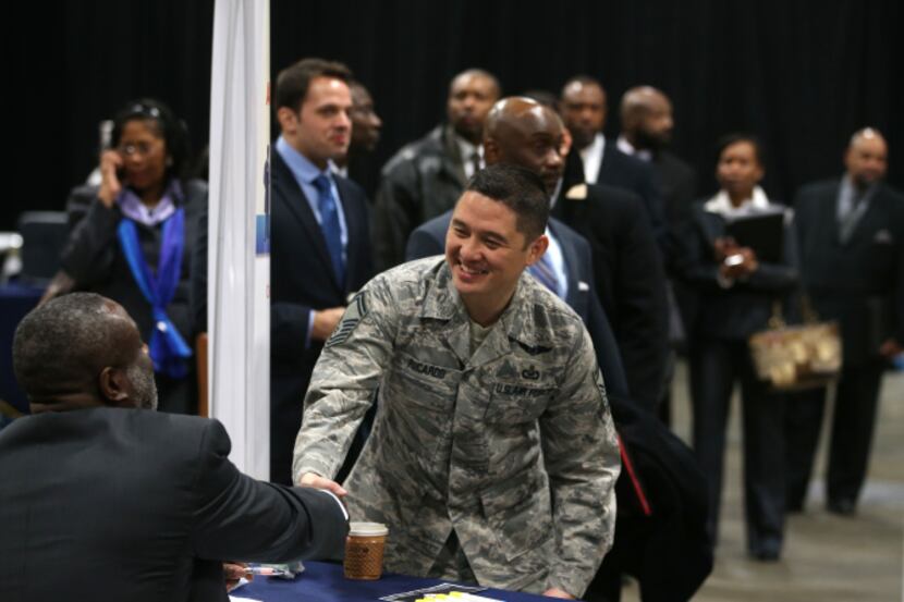 Air Force Master Sgt. Cecilio Ricardo visits a Department of Veterans Affairs booth while...