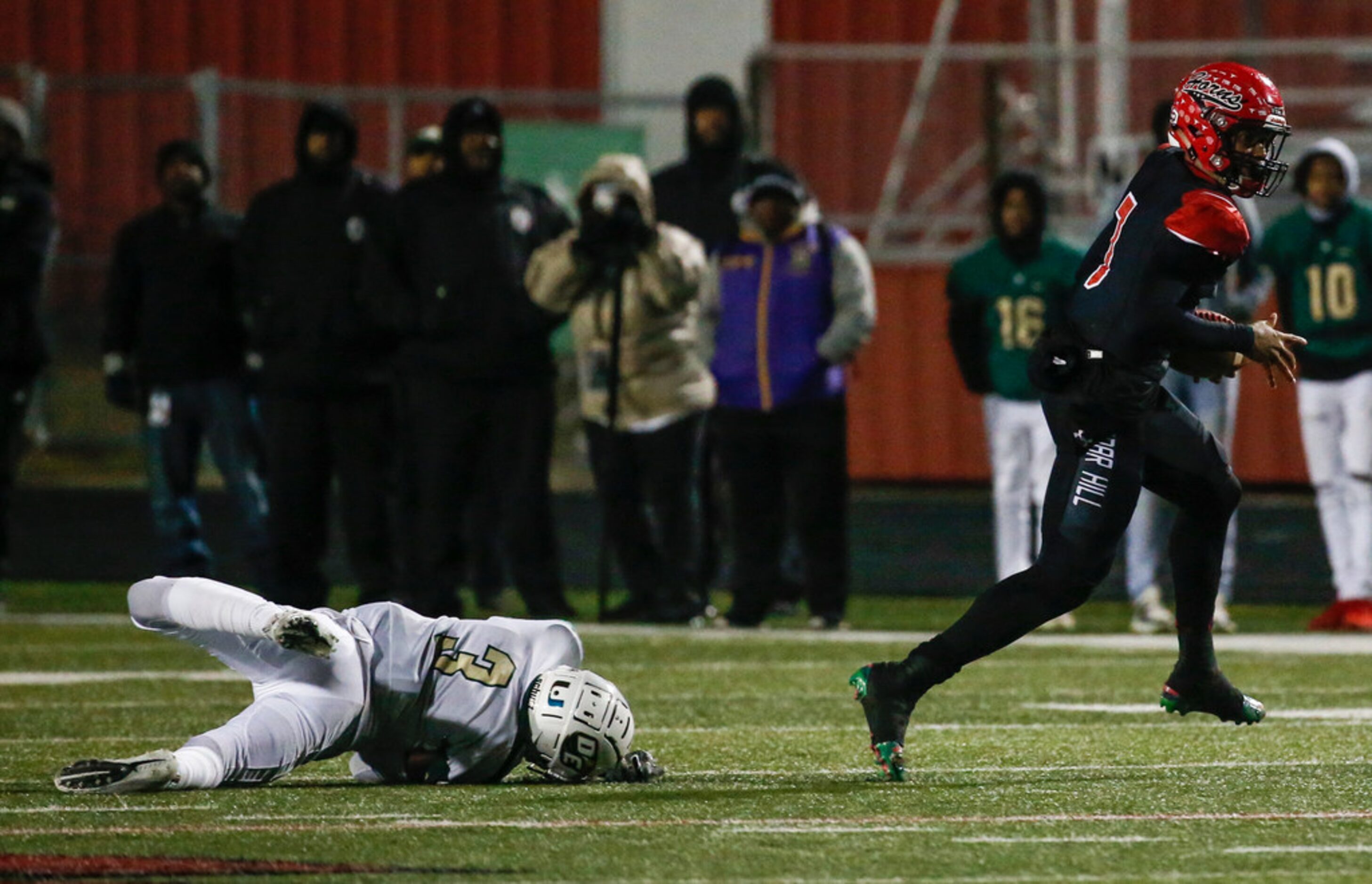 Cedar Hill quarterback Kaidon Salter (7) makes a break away from DeSoto defensive back Devyn...