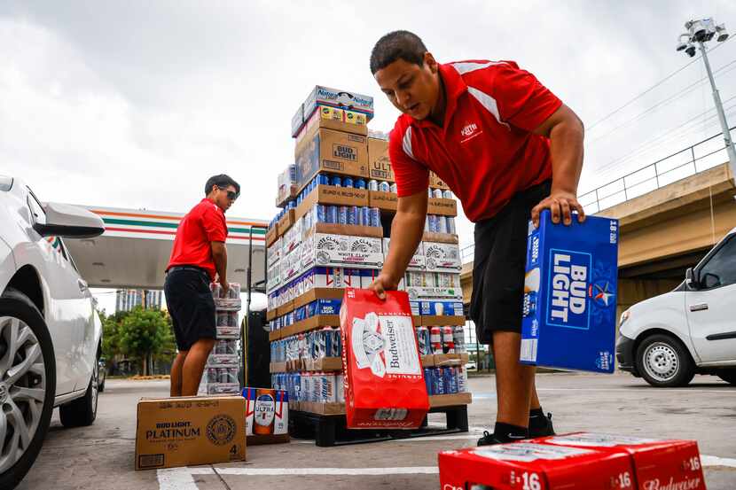 German Gonzalez (left) and Santiago Maturino make a delivery to a 7-Eleven store on...