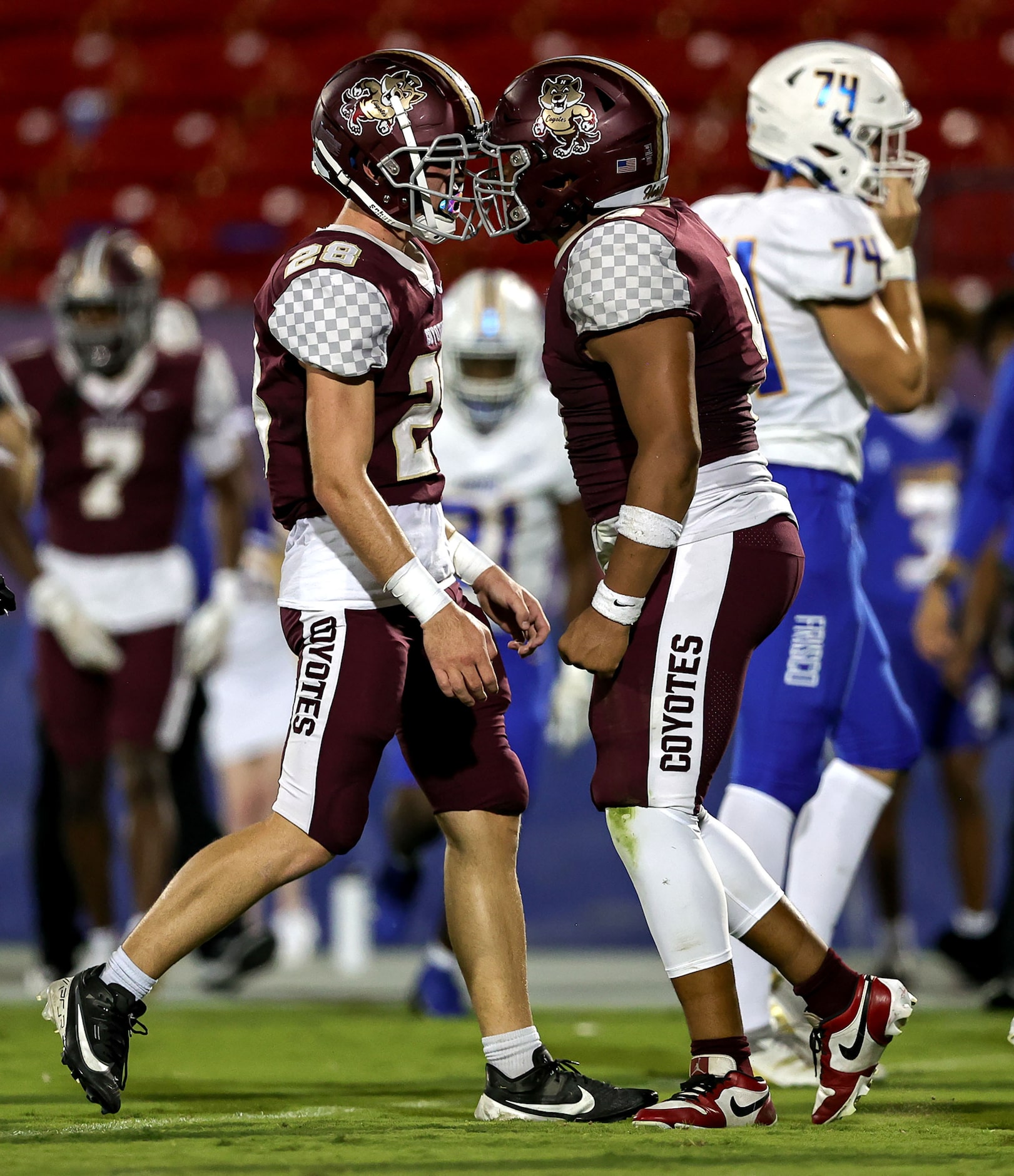 Frisco Heritage defensive lineman Dominic Nolan (R) and linebacker Taidan Waltz (28)...