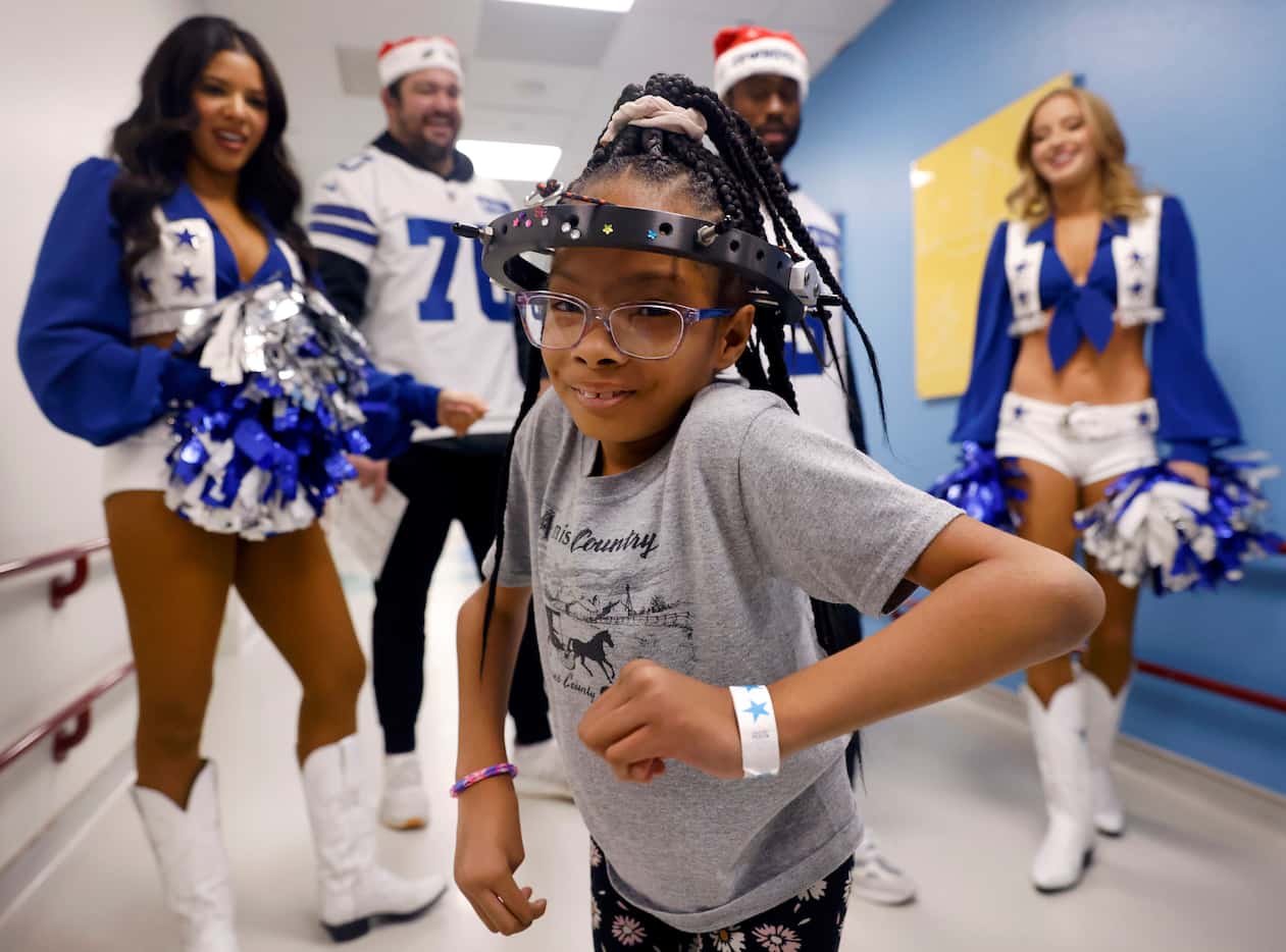 Serenitee Jackson was all smiles after she learned a cheer from Dallas Cowboys Cheerleader...