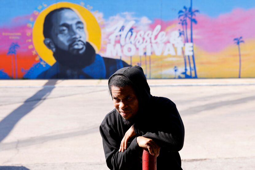 Yafeuh Balogun, founder of the Huey P. Newton Gun Club, looks towards other members of...