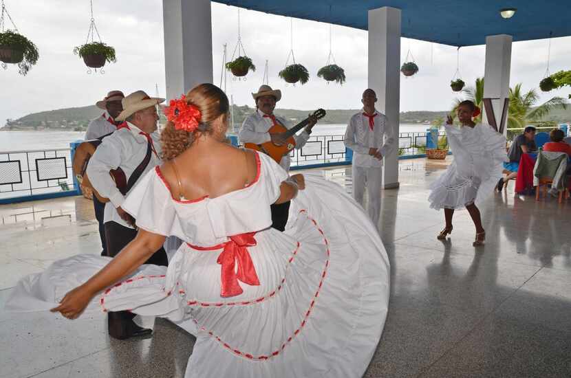 Left:  Adonia passengers enjoyed lunch and a dance performance at Punta  Gorda restaurant in...