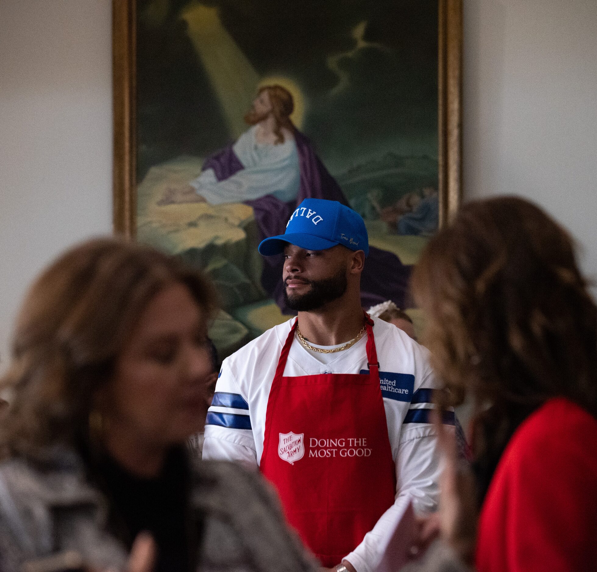 Dallas Cowboys starting quarterback Dak Prescott waits to to serve Thanksgiving meals at The...