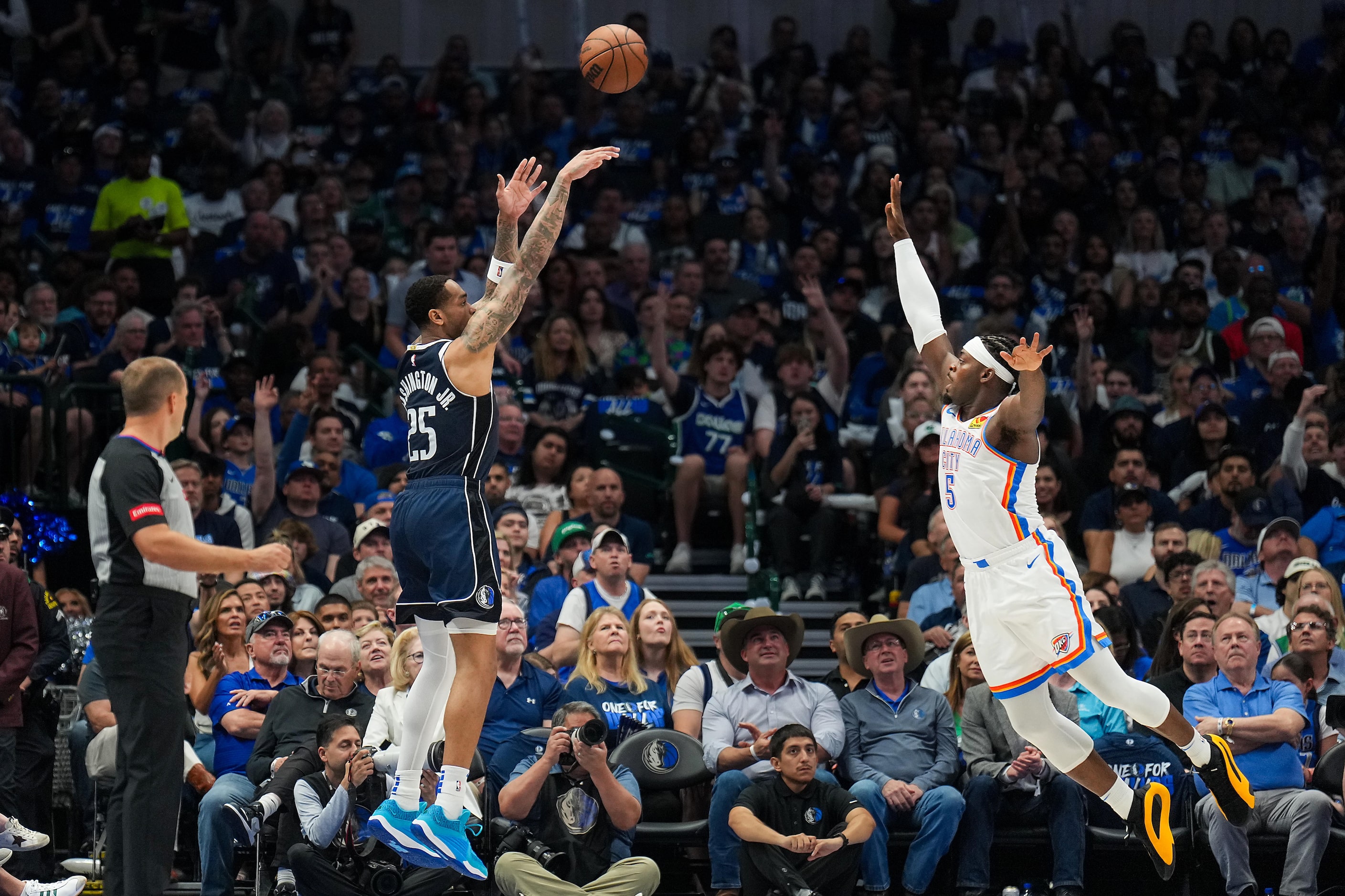 Dallas Mavericks forward P.J. Washington (25) hits a 3-pointer over Oklahoma City Thunder...