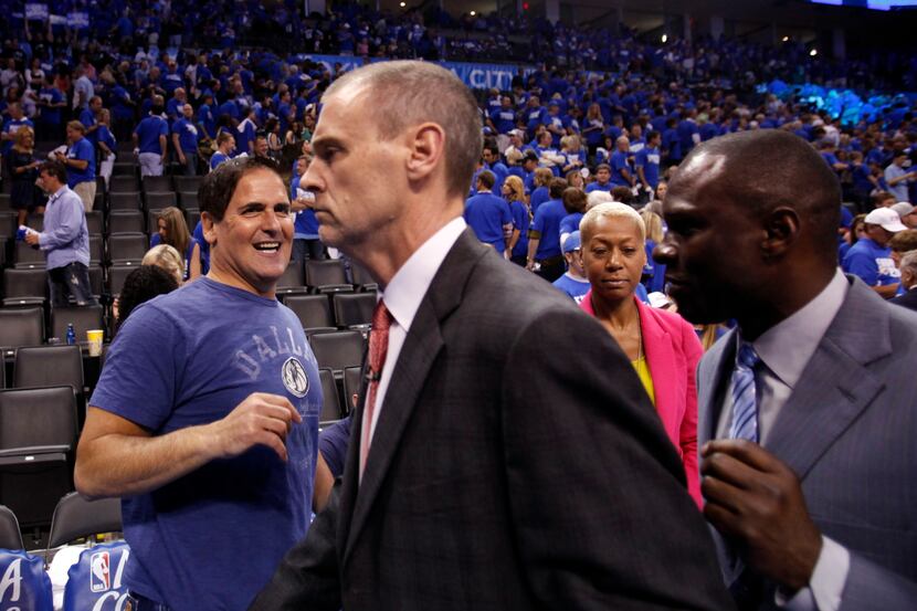 Dallas Mavericks owner Mark Cuban congratulates Dallas Mavericks head coach Rick Carlisle...