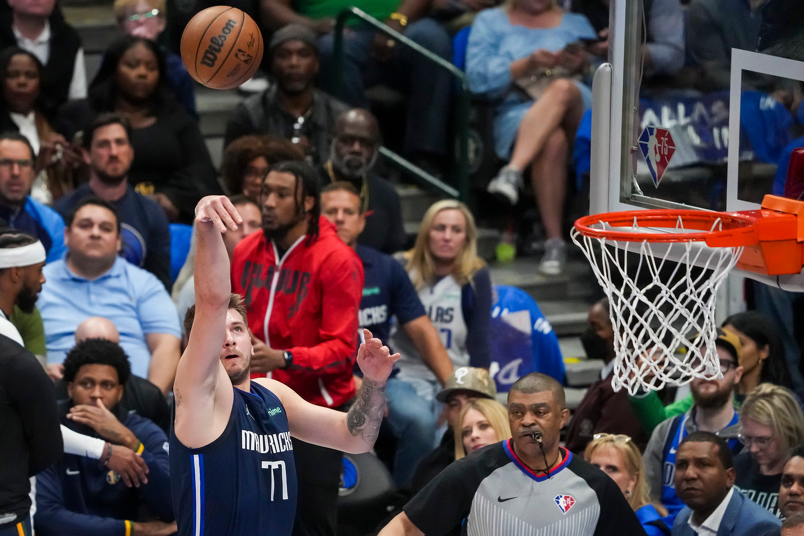 Dallas Mavericks guard Luka Doncic (77) takes a shot during the first half in Game 5 of a...