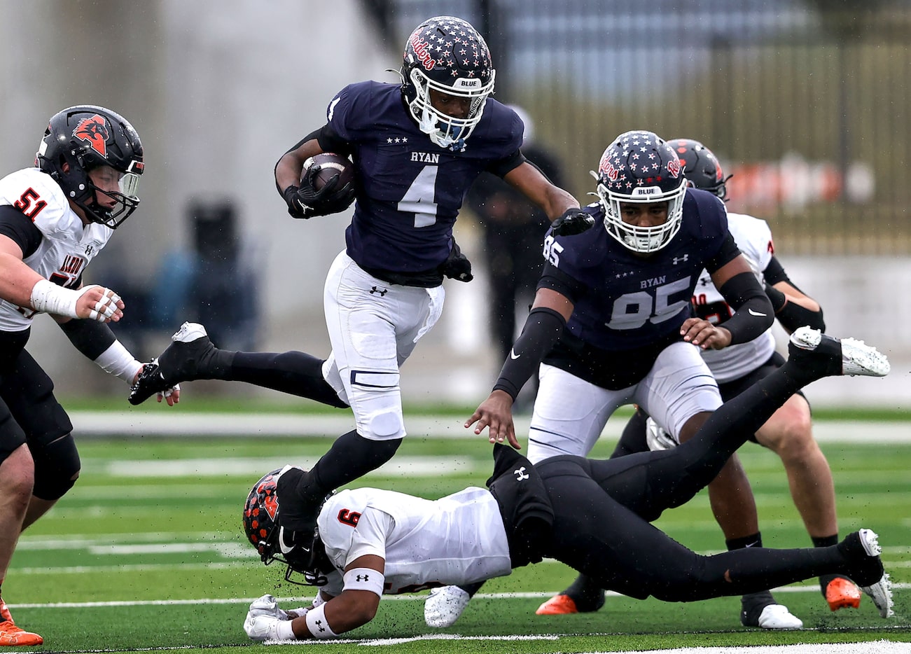 Denton Ryan running back Tre'Vaughn Reynolds (4) goes over Aledo safety Lamel Swanson (6)...