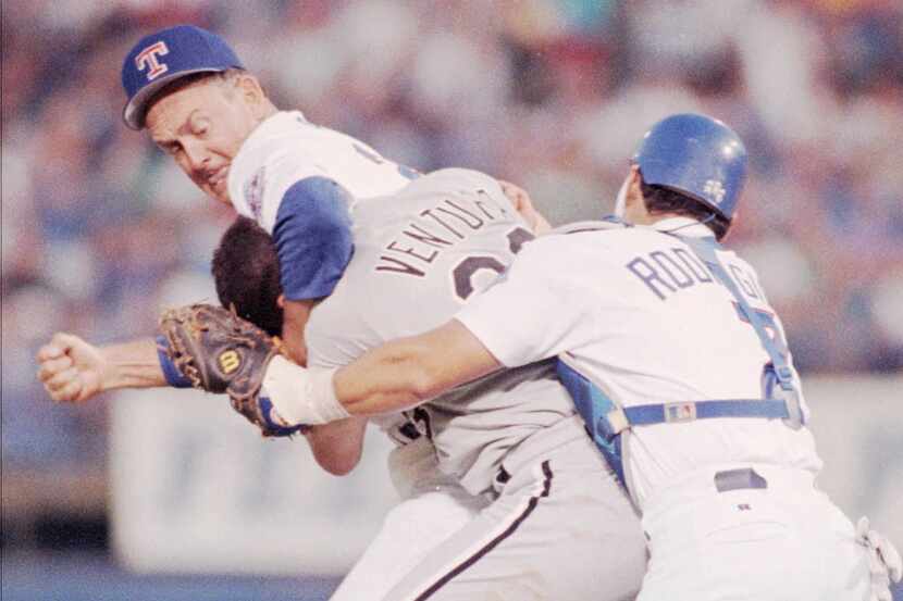 Texas Rangers pitcher Nolan Ryan (left) prepares to defend himself against Chicago White...