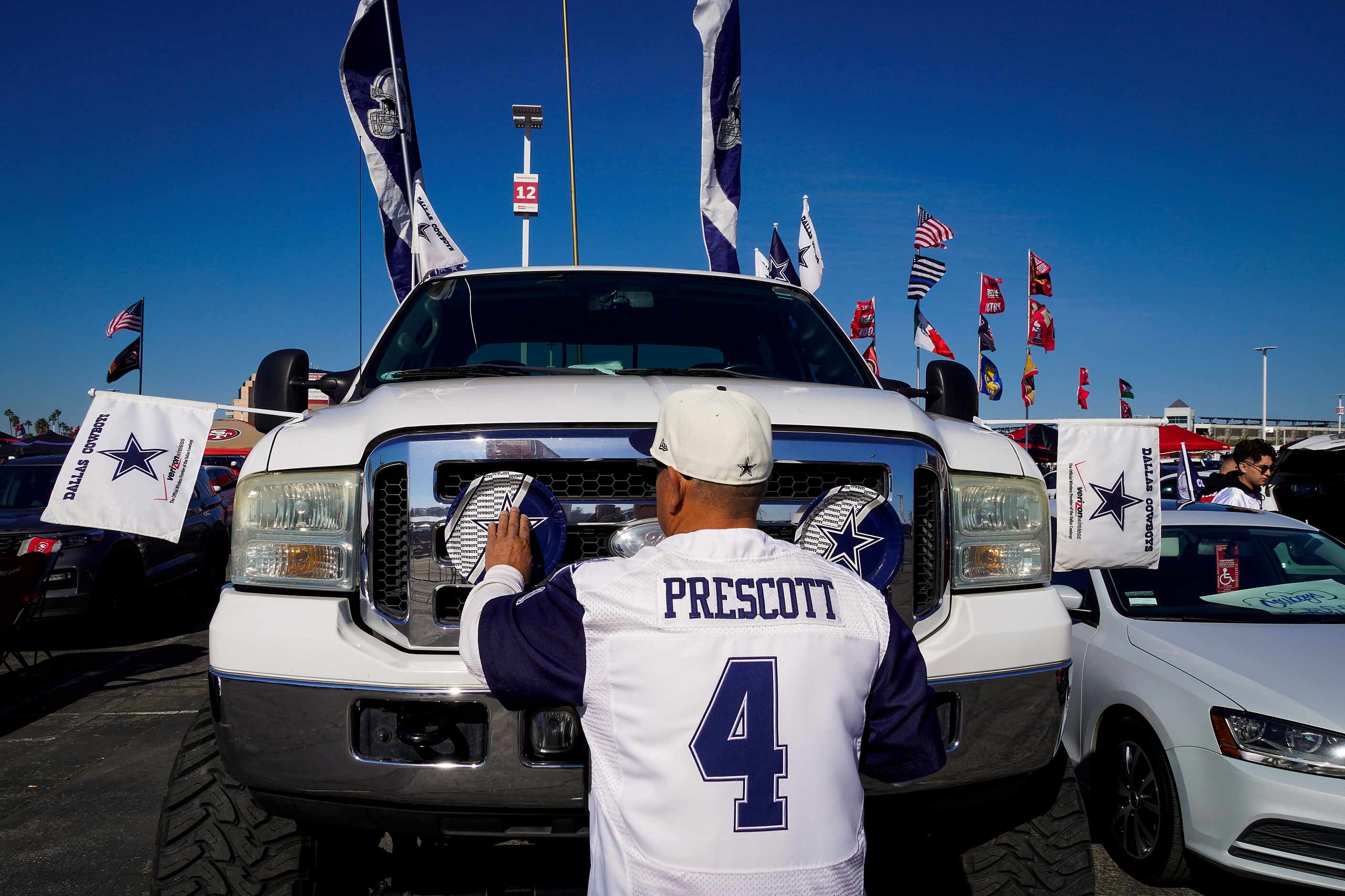 Dallas Cowboys fan Frank Smith sets up his truck for tailgating before an NFL divisional...