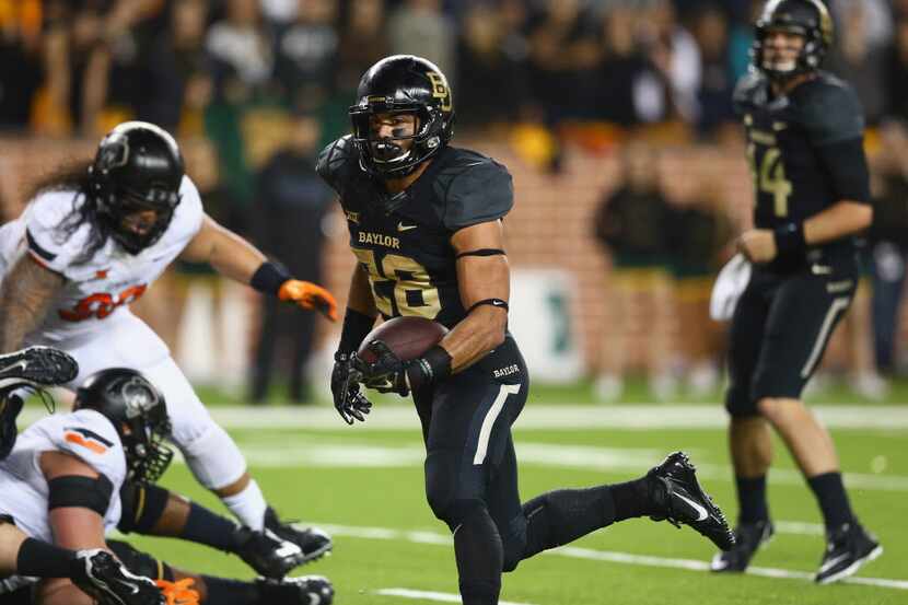 WACO, TX - NOVEMBER 22: Devin Chafin #28 of the Baylor Bears runs for a touchdown against...