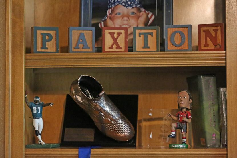 Some of the memorabilia of Paxton Pomykal, including a bobblehead of his FC Dallas coach....