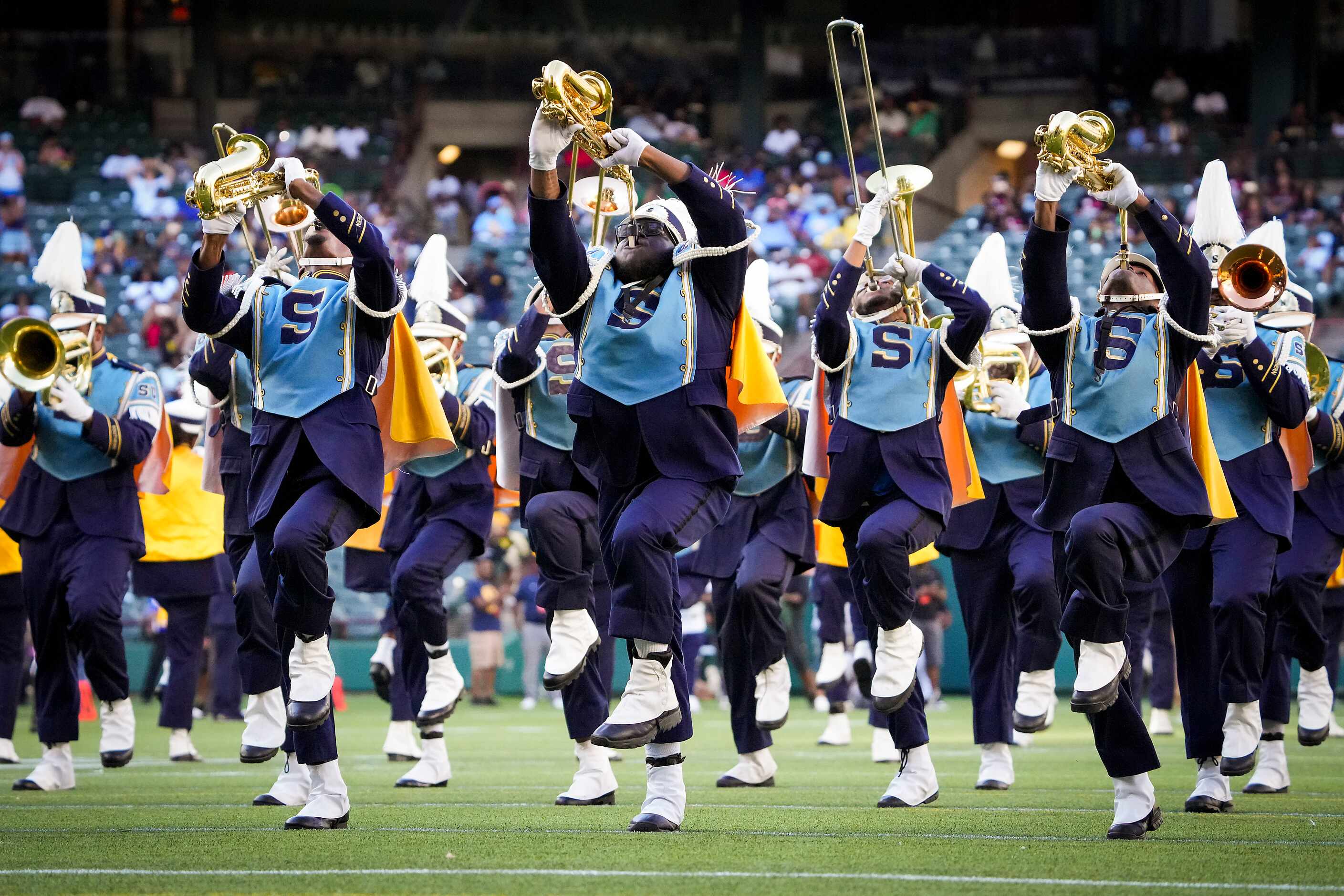 Members of the Southern Human Jukebox marching band perform during halftime of an NCAA...
