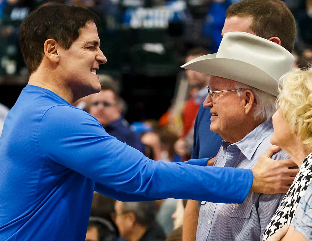 Dallas Mavericks owner Mark Cuban (left) hugs former team owner Don Carter  before an NBA...
