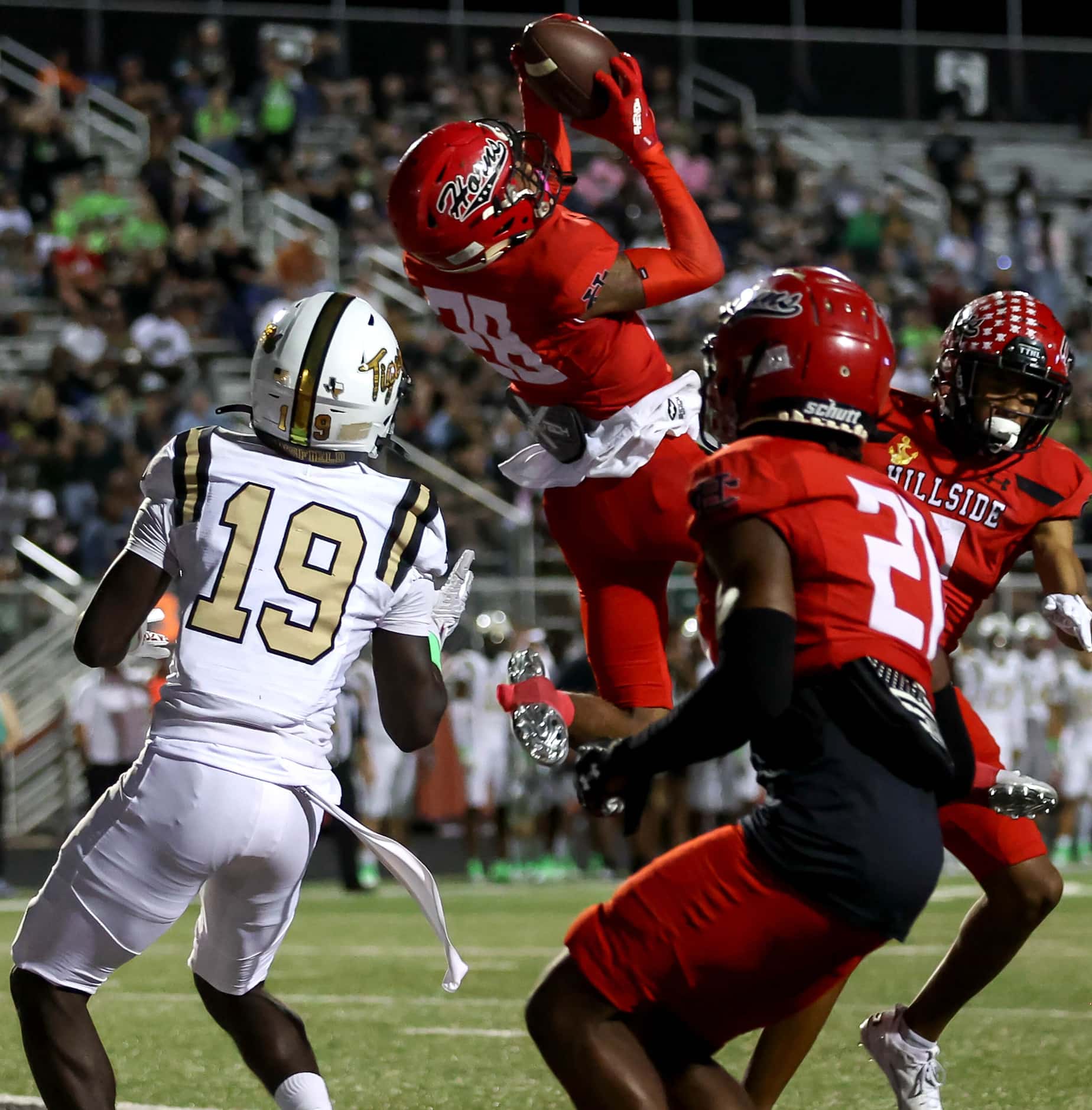Cedar Hill strong safety Michael Parker (28) comes up with an interception against Mansfield...