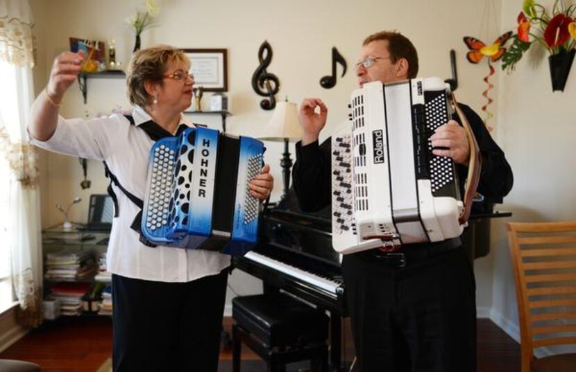 
Elena and Gregory Fainshtein let their final note sound after playing a song on the...