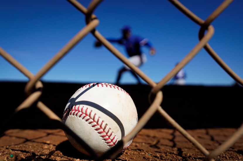Texas Rangers pitcher James Jones throws in the bullpen during the first spring training...