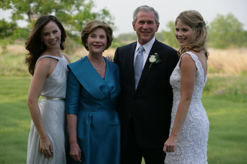 Former President George Bush poses with his family at his daughter, Jenna's, wedding to...