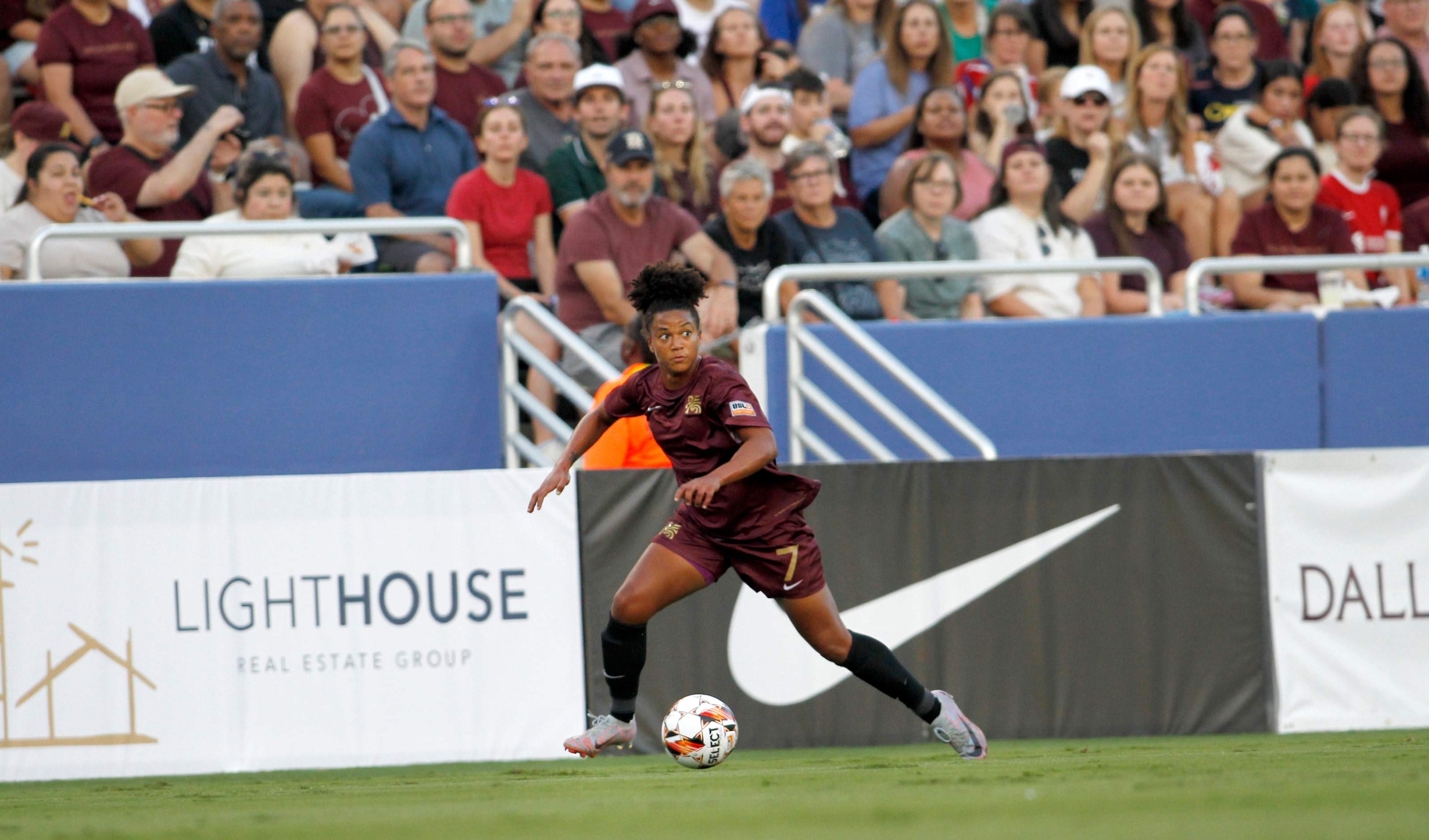 Dallas Trinity FC's Enzi Broussard (7) surveys the defense of DC Power FC during first half...