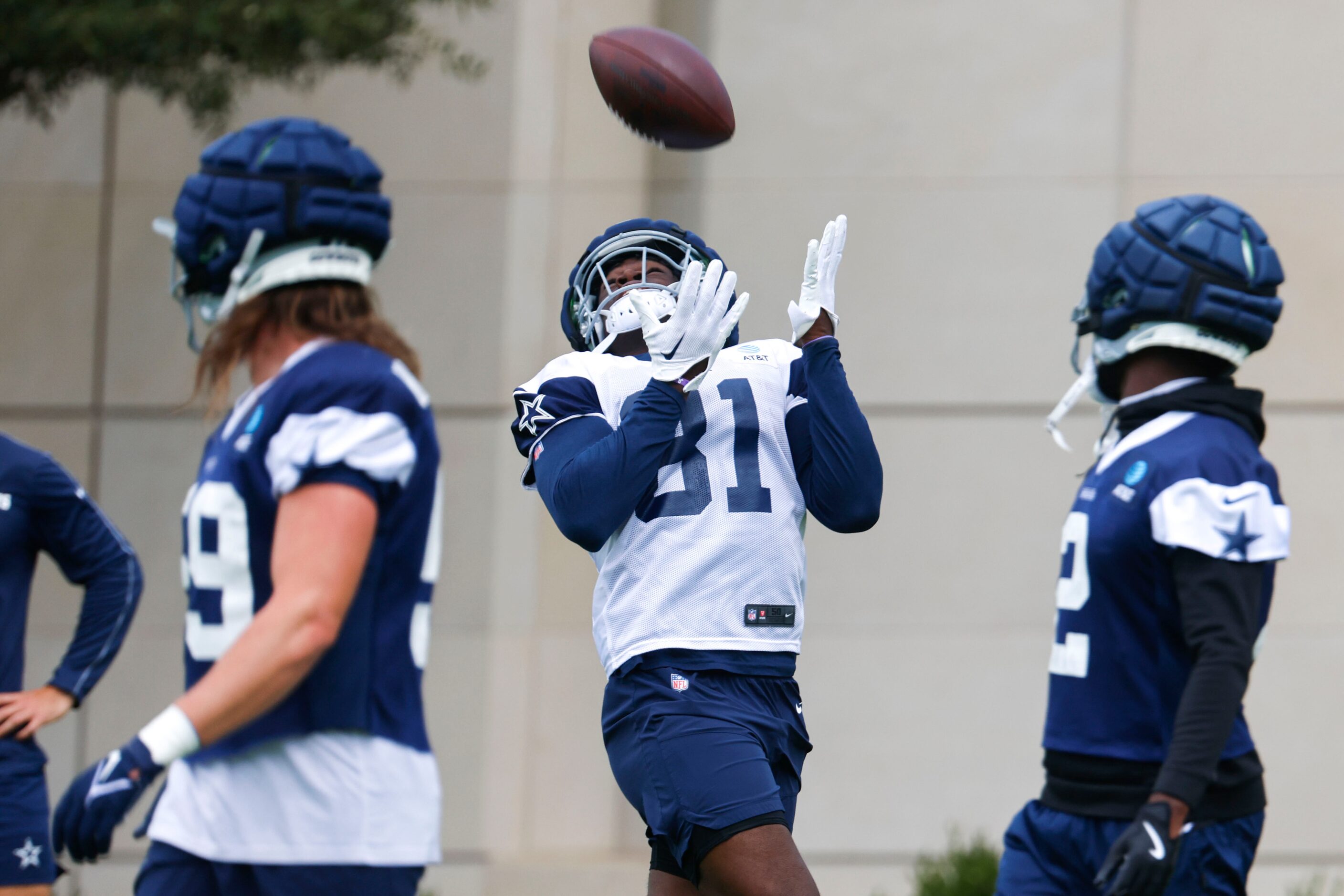 Dallas Cowboys tight end John Stephens (81) receives a pass during a team practice, on...