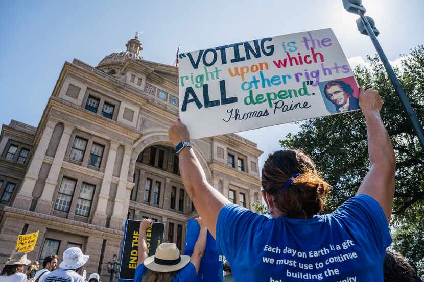 Activists rally at the Texas state Capitol in July after completing a 27-mile march from...