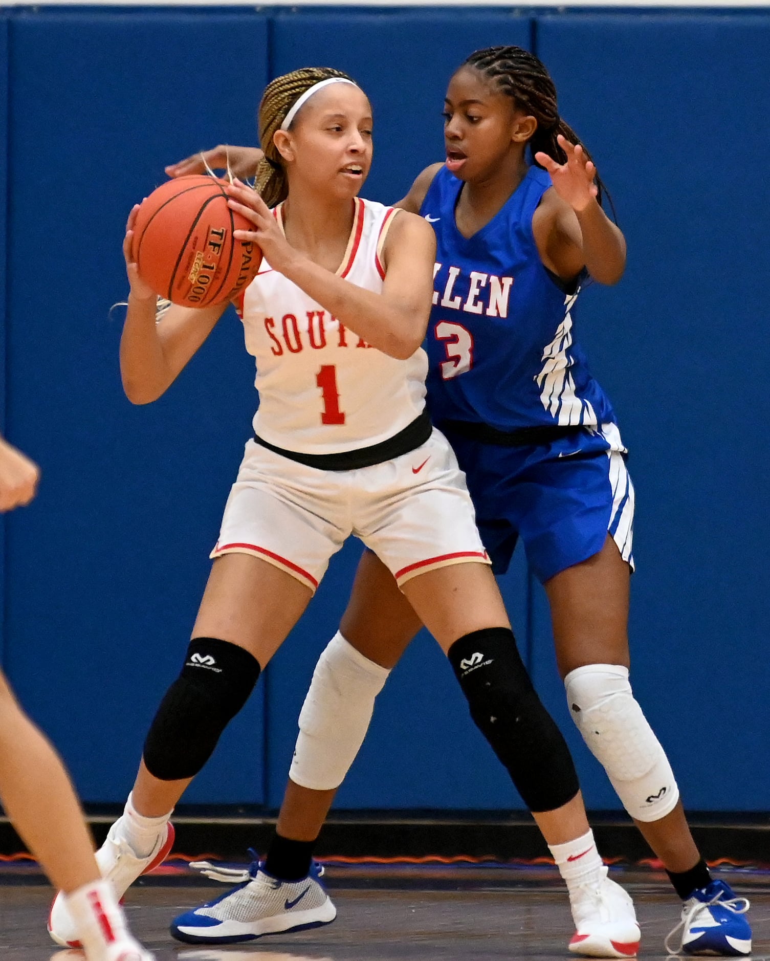 South Grand Prairie’s Kendall McGruder (1) looks to pass around Allen’s Alicia Mills in the...