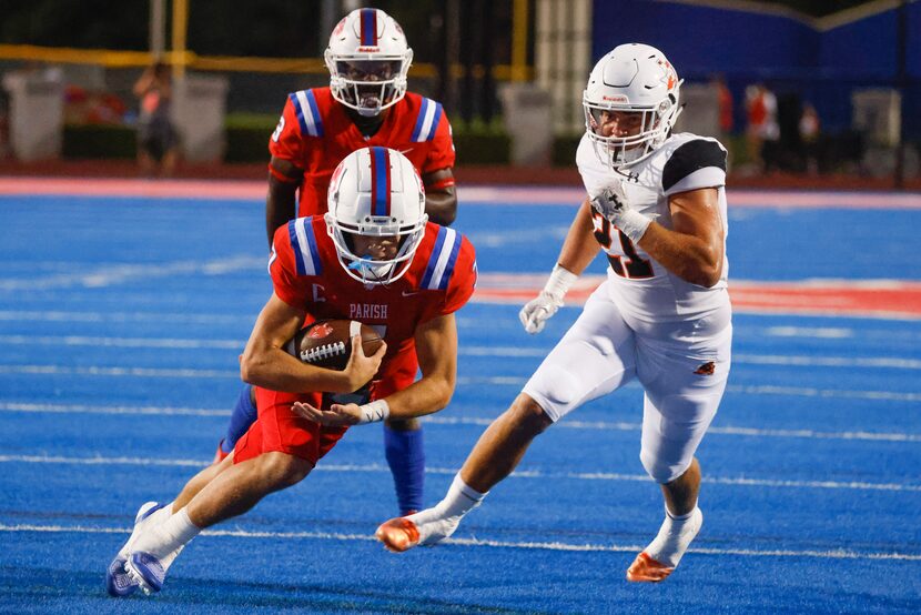 Parish Episcopal’s QB Sawyer Anderson, attempts to complete a touchdown past Aledo High’s...