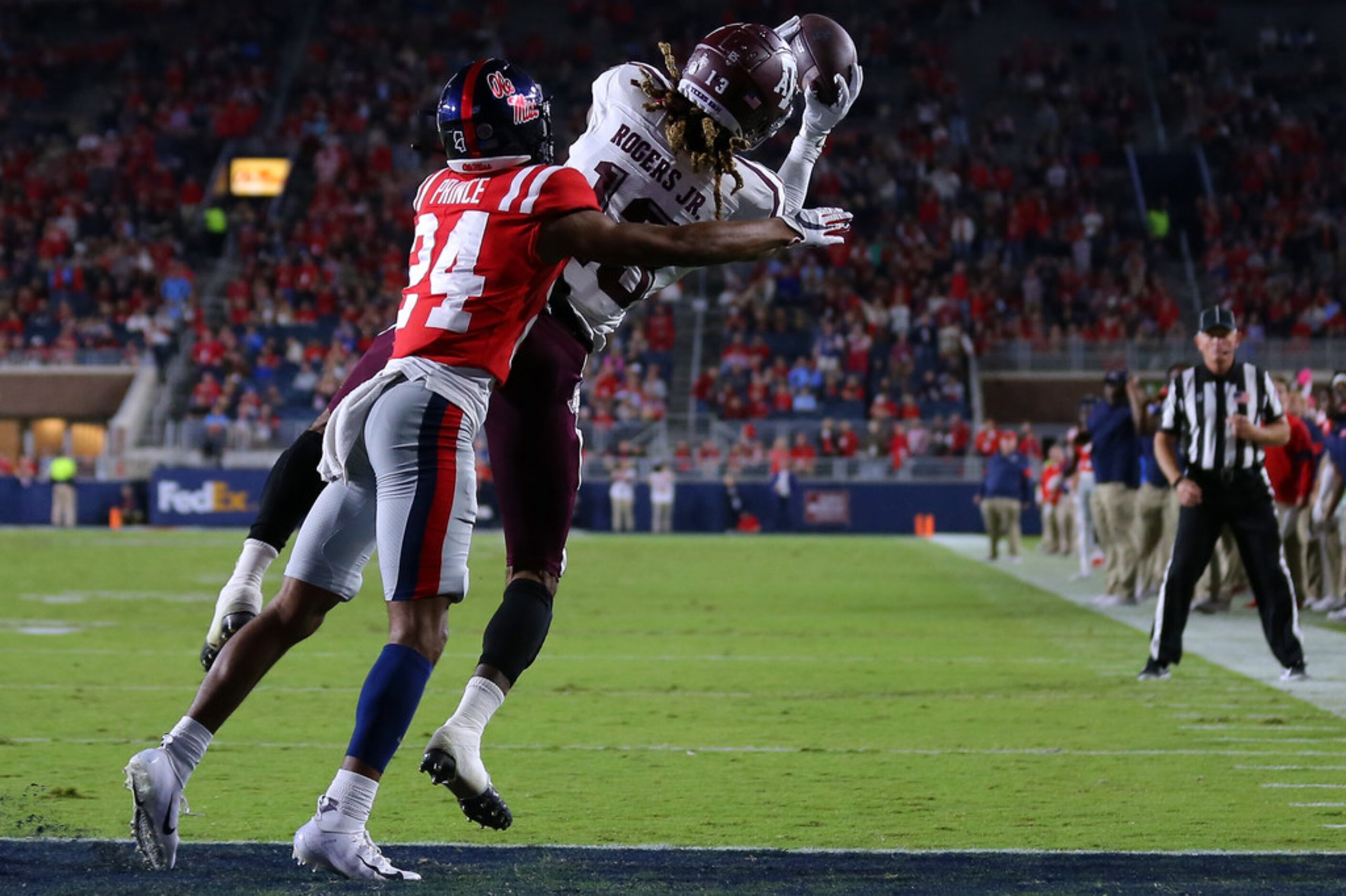 OXFORD, MISSISSIPPI - OCTOBER 19: Kendrick Rogers #13 of the Texas A&M Aggies celebrates a...