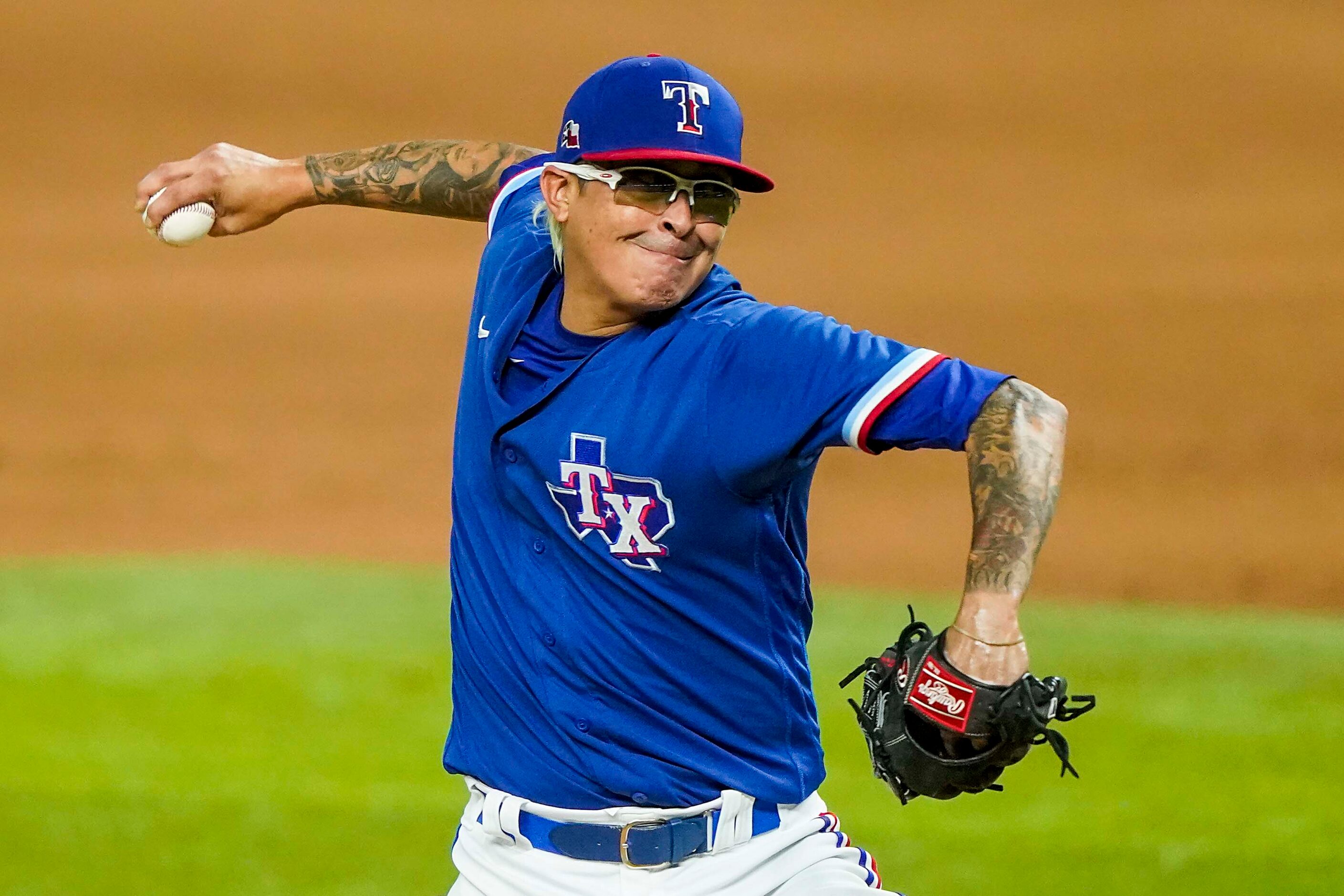 Texas Rangers pitcher Jesse Chavez pitches during the sixth inning of an exhibition game...