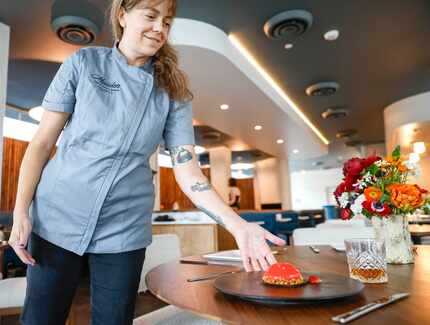 Amy McNutt, owner and executive chef of Maiden, sets down strawberry entremets, a dessert....