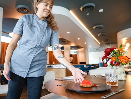 Amy McNutt, owner and executive chef of Maiden, sets down strawberry entremets, a dessert....