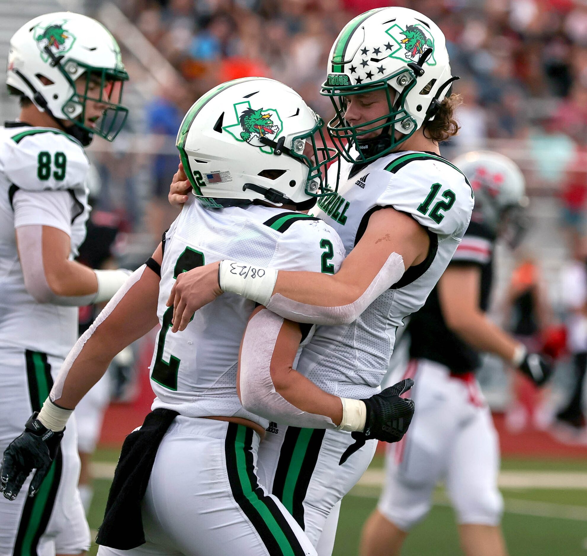 Southlake Carroll running back Owen Allen (2) celebrates with quarterback Kaden Anderson...