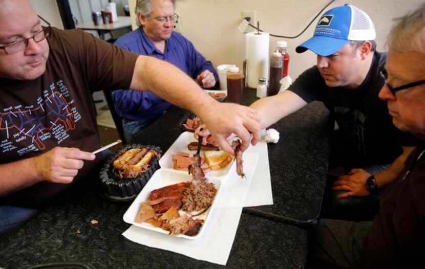 
The Texas BBQ Posse dives into smoked ribs, brisket, shredded pork, and bologna during a...