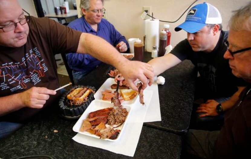 
The Texas BBQ Posse dives into smoked ribs, brisket, shredded pork, and bologna during a...