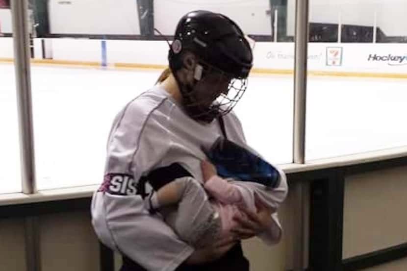 Sabrina Pfeifer breastfeeding her 5-month-old, Kaci, at the ice rink 