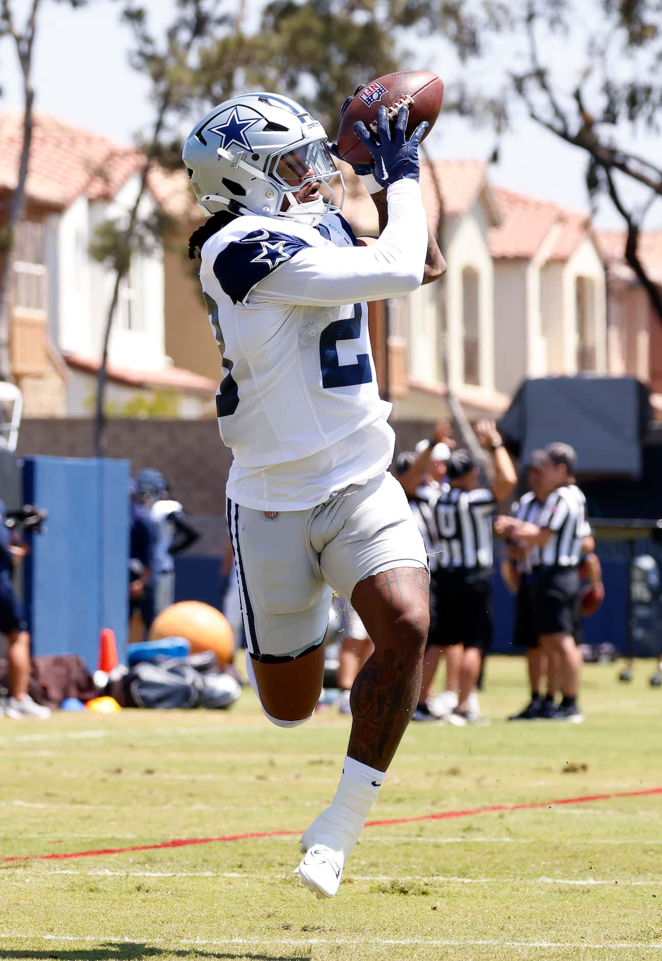 Dallas Cowboys running back Rico Dowdle (23) catches a deep route pass during training camp...
