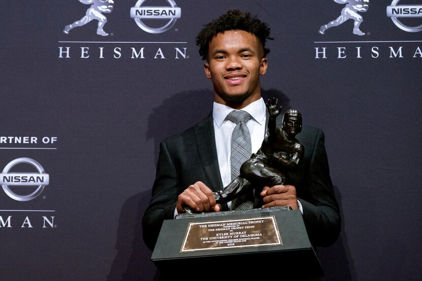 FILE - In this Dec. 8, 2018, file photo, Oklahoma quarterback Kyler Murray holds the Heisman...